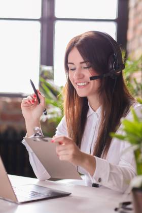 Woman working in call center as dispatcher